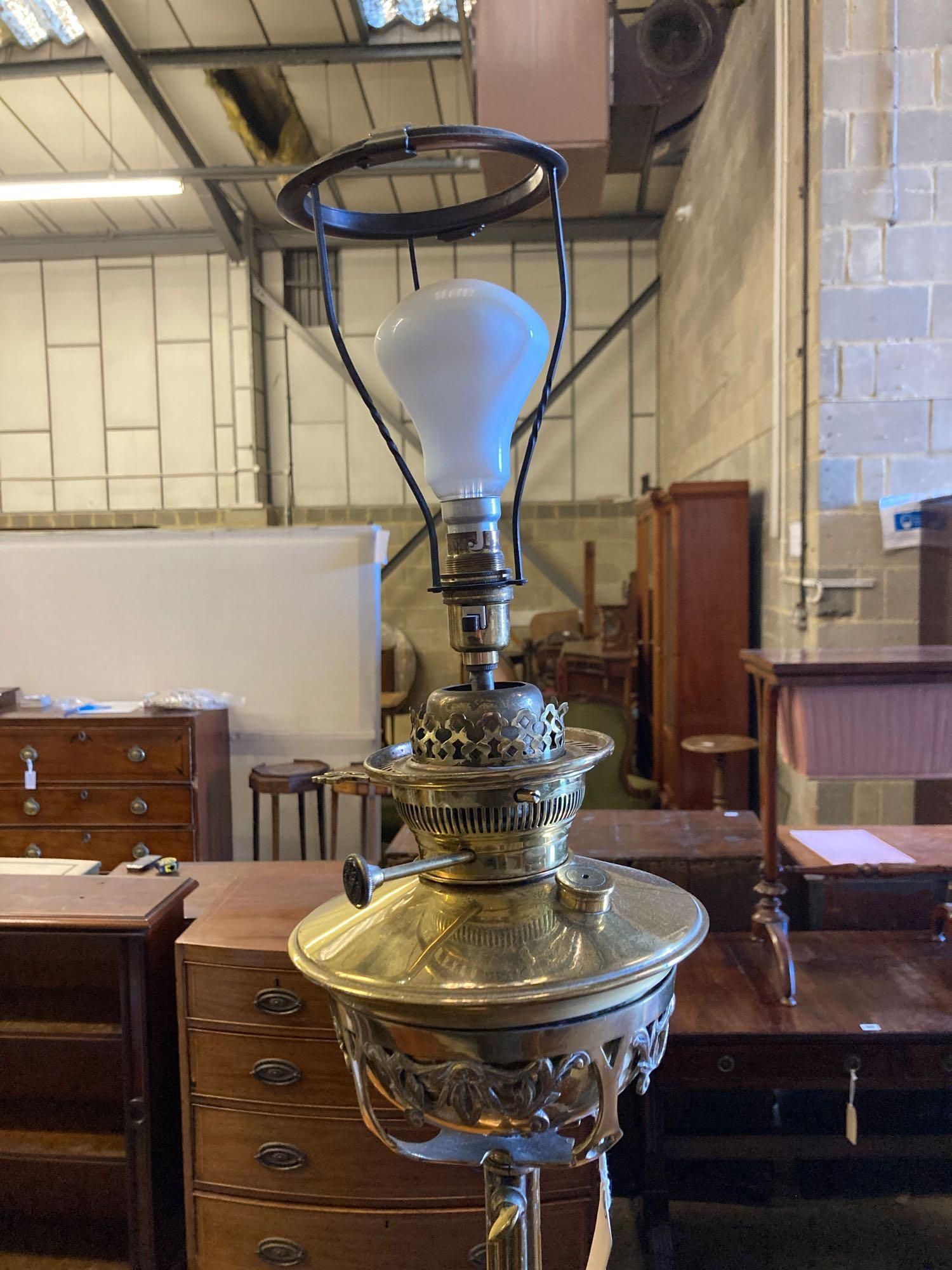 An Edwardian brass lamp standard with table base
